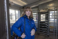 Crystal Bowen, a generation clerk at the Naughton Power Plant, arrives at the plant Wednesday, Jan. 12, 2022, in Kemmerer, Wyo. Bowen is hopeful about Kemmerer being chosen as the site of a nuclear reactor when the coal-fired power plant she works at is decommissioned in 2025, saying the plant should allow her and others with Rocky Mountain Power to shift to jobs at the new plant. "I don't know if Kemmerer would have survived if we lost the power plant and the coal mine. It may have just turned into a ghost town," said Bowen. (AP Photo/Natalie Behring)