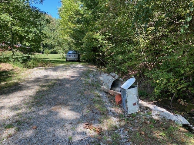 A damaged mailbox marks the scene where Brown County resident Bob Adair was shot to death in September 2021.