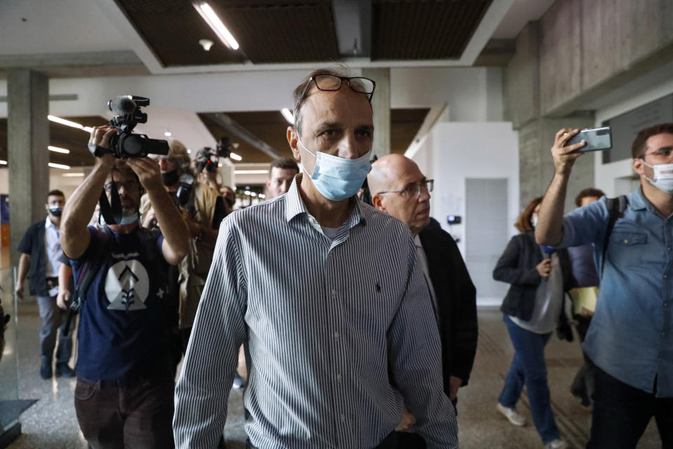 Shmulik Peleg, grandfather of Eitan Biran, who survived a cable car crash in Italy that killed his immediate family, arrives at court in Tel Aviv, Thursday, Nov. 11, 2021. (AP Photo/Ariel Schalit)