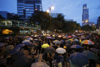 Protesters gather during a demonstration in Hong Kong, Saturday, Aug. 3, 2019. Hong Kong protesters ignored police warnings and streamed past the designated endpoint for a rally Saturday in the latest of a series of demonstrations targeting the government of the semi-autonomous Chinese territory. (AP Photo/Vincent Thian)