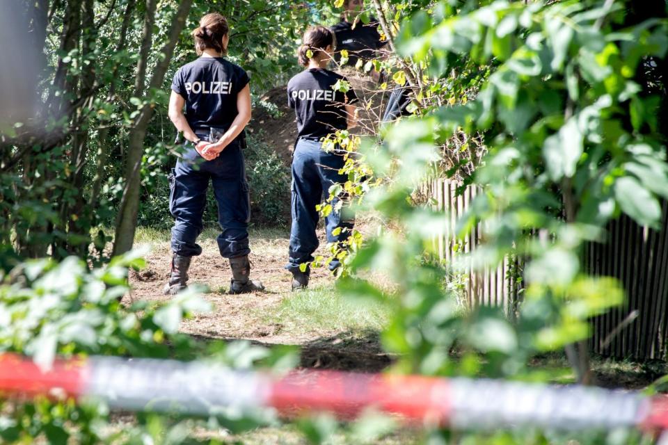 German police stand during a search in a garden allotment in the northern German city of Hanover (AFP via Getty Images)