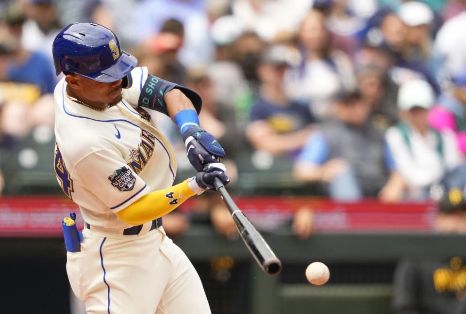 Seattle Mariners' Julio Rodriguez hits a single against the Pittsburgh Pirates during the third inning of a baseball game Sunday, May 28, 2023, in Seattle. (AP Photo/Lindsey Wasson)