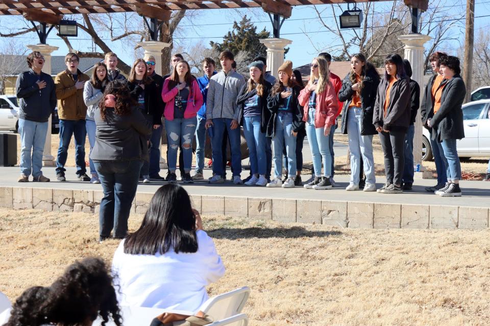 The Amarillo ISD Choir sings the national anthem for the activities after a previous year's MLK parade that ended at Bones Hooks Park.