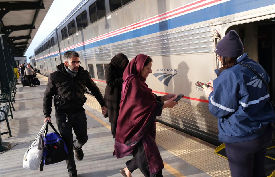 Passengers are shown boarding Amtrak's Heartland Flyer at Santa Fe Station in downtown Oklahoma City.