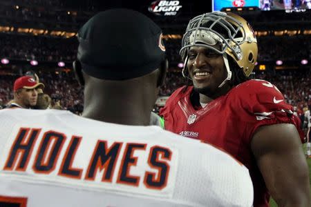 Sep 14, 2014; Santa Clara, CA, USA; San Francisco 49ers defensive end Ray McDonald (91) talks with Chicago Bears wide reciever Santonio Holmes (14)at the end of their NFL football game at Levis Stadium. Mandatory Credit: Lance Iversen-USA TODAY Sports