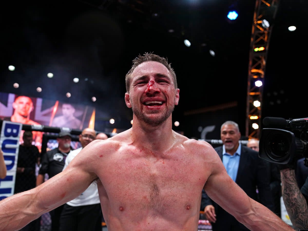 Brendan Loughnane celebrates winning the PFL featherweight title and $1m in New York (Cooper Neill / PFL)