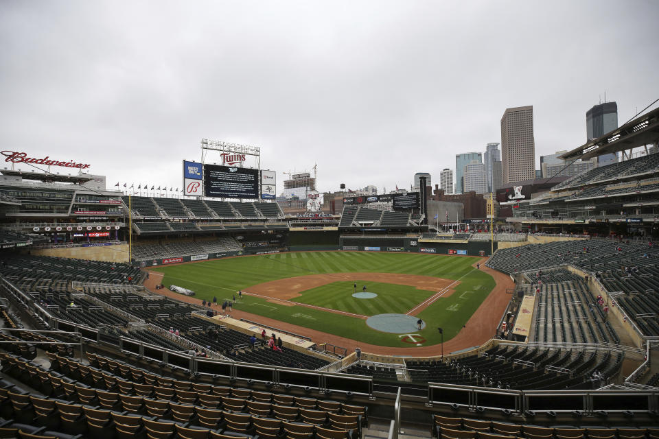 The scoreboard at Target Field explains the postponement of the baseball game between the Minnesota Twins and Boston Red Sox, Monday, April 12, 2021, in Minneapolis. The Twins postponed their game against the Red Sox because of safety concerns following the fatal police shooting of a Black man and the potential for unrest in the area. (AP Photo/Stacy Bengs)