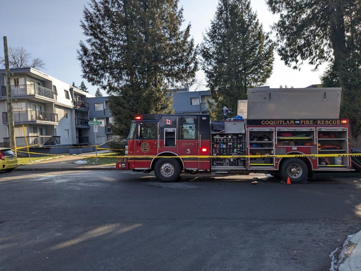 Firefighters were still on scene Thursday morning, hours after an overnight fire tore through several units of an apartment building in Coquitlam, B.C. (Joel Ballard/CBC - image credit)