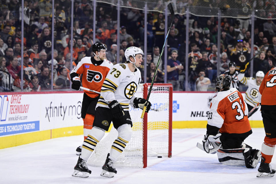 Boston Bruins' Charlie McAvoy (73) celebrates after scoring a goal past Philadelphia Flyers goaltender Samuel Ersson (33) during the first period of an NHL hockey game, Saturday, Jan. 27, 2024, in Philadelphia. (AP Photo/Derik Hamilton)