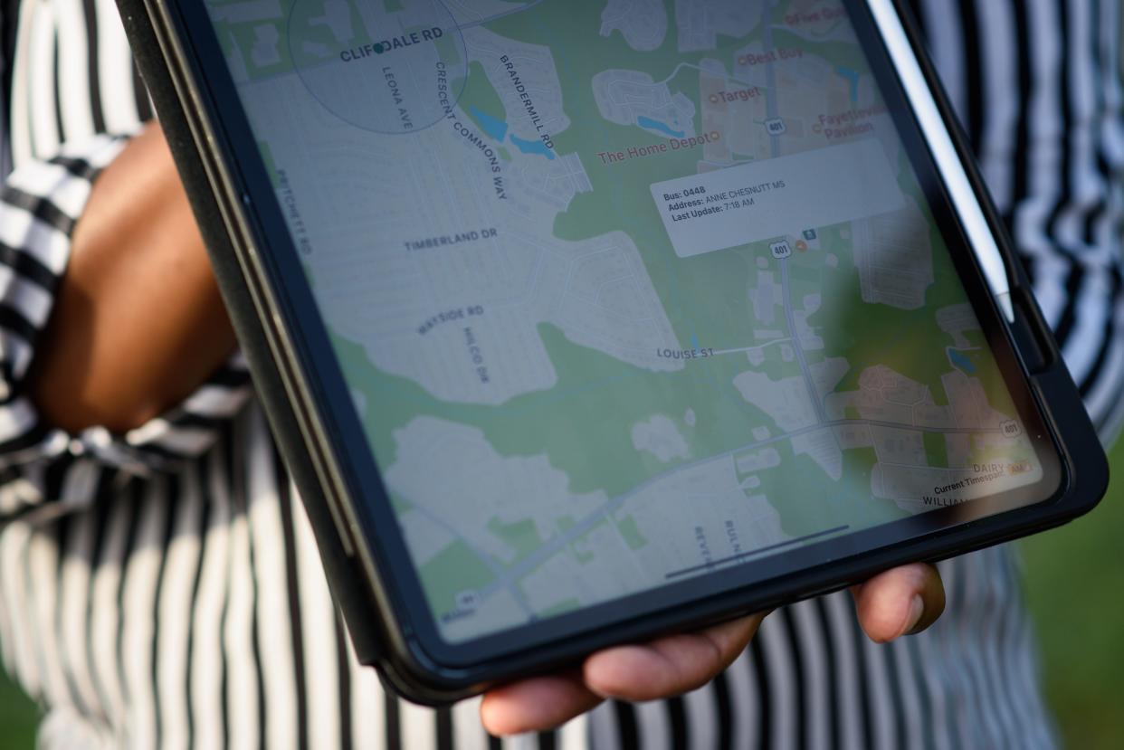 A Cumberland County Schools official shows off a mobile app that students and parents can use to track their school bus.