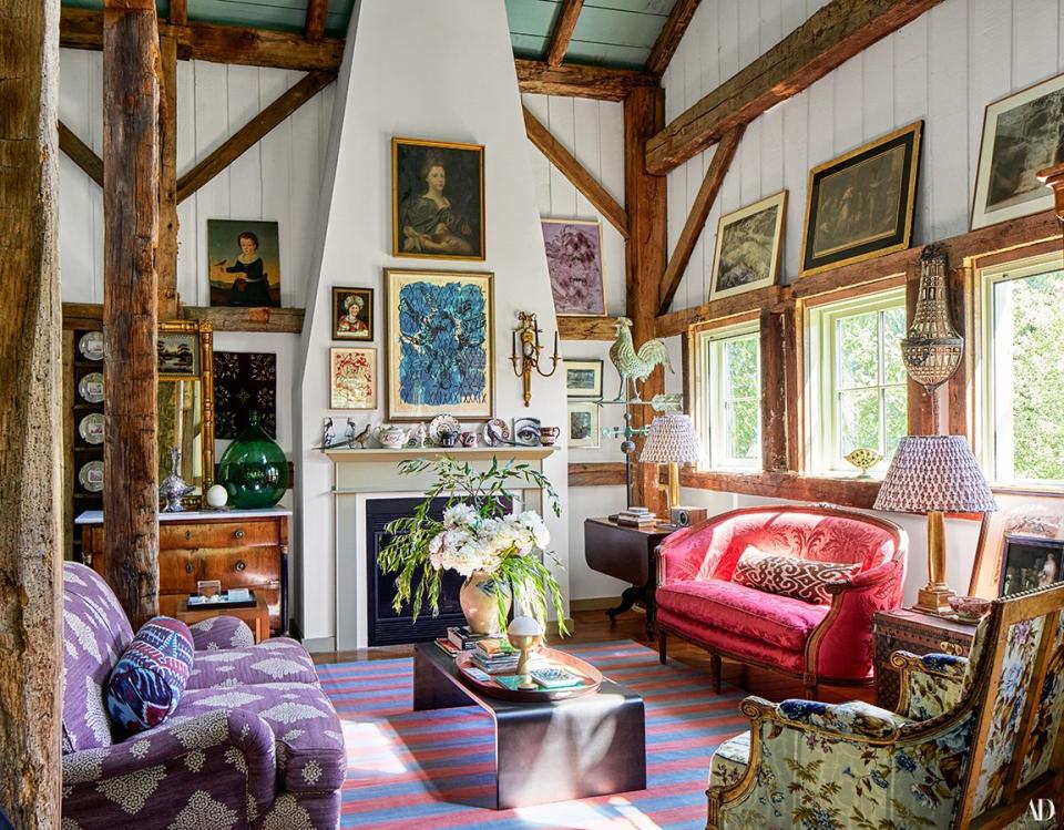 The living room is filled with art, including six works by François Rouan. From left, George Smith sofa covered with a Pierre Frey cotton-blend; Jean-Michel Frank and Adolphe Chanaux cocktail table from Ralph Pucci; Louis XVI bergère in a Le Manach cotton; and Louis XVI settee in a 1940s French damask.