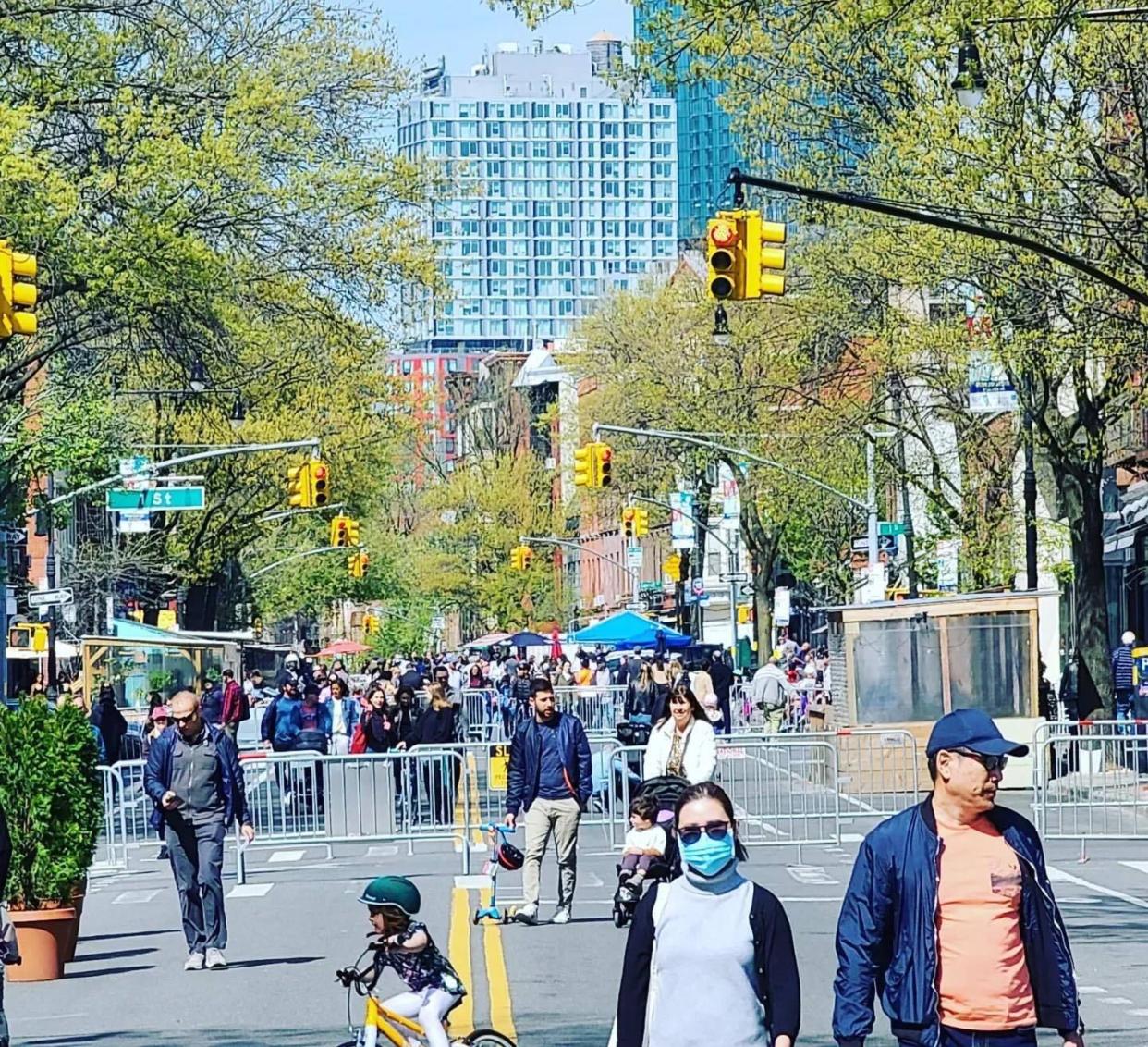 Pedestrians enjoy Park Slope's Open Streets program.