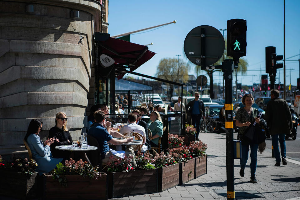 Image: People have lunch at a restaurant in Stockholm, during the coronavirus COVID-19 pandemic on April 22, 2020. (Jonathan Nackstrand / AFP - Getty Images file)