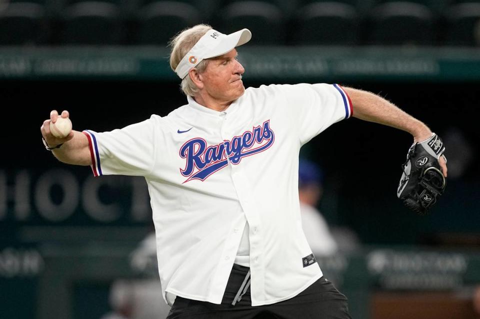 Rickey Hill, who inspired an upcoming movie titled, “ The Hill”, throws out the ceremonial first pitch before a baseball game between the Los Angeles Angels and Texas Rangers, Wednesday, Aug. 16, 2023, in Arlington, Texas. (AP Photo/Tony Gutierrez)