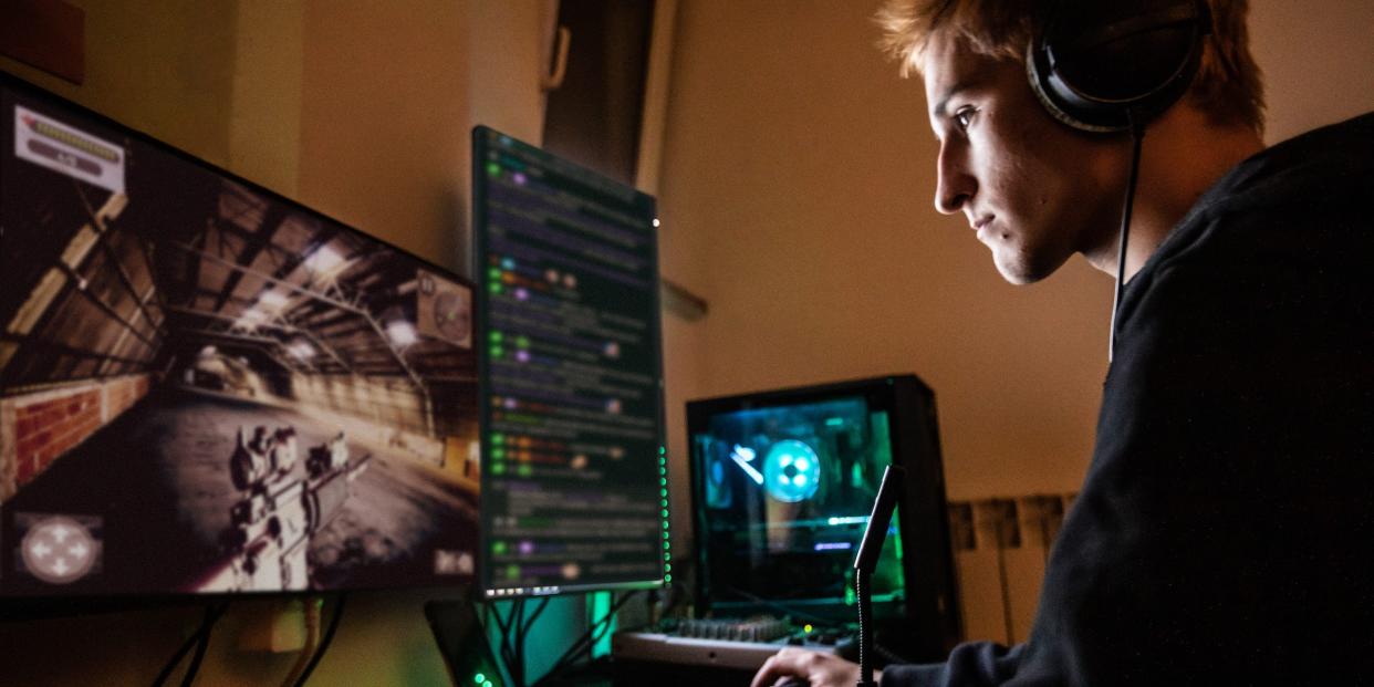 teen playing desktop computer games