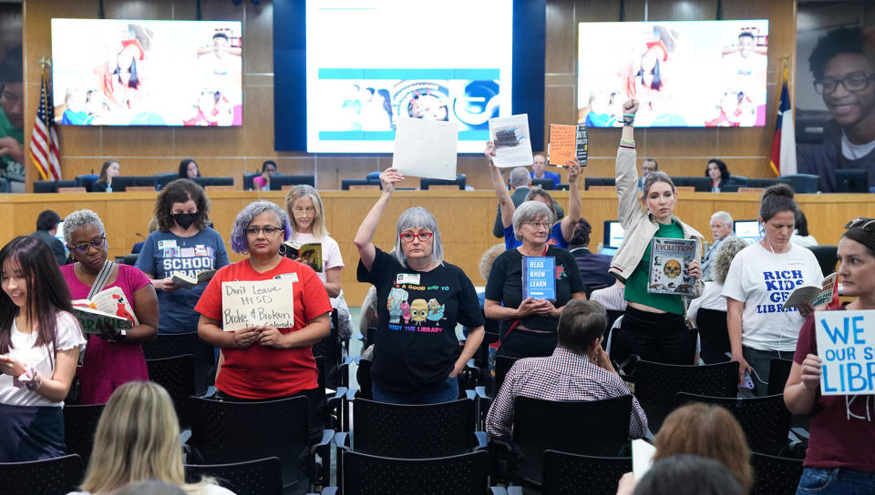 People protest during a HISD school board meeting in Houston (Elizabeth Conley / Houston Chronicle via Getty Images file)