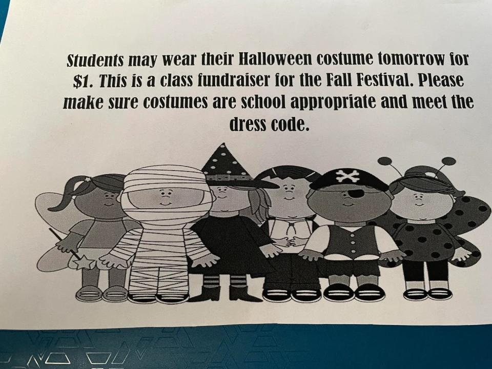 Flyer states: Students can wear Halloween costumes tomorrow for $1 for a class fundraiser. Costumes must be school appropriate and follow the dress code