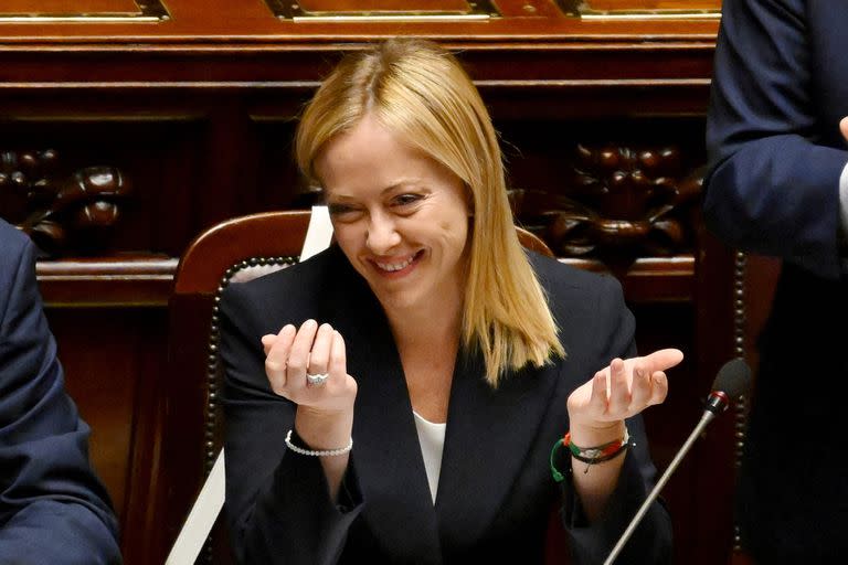 Italy’s new Prime Minister Giorgia Meloni reacts after her first address to parliament ahead of a confidence vote at Montecitirio palace in Rome on October 25, 2022. - Meloni said that Italy would "continue to be a reliable partner of NATO in supporting Ukraine", amid concerns over the pro-Russian stance of her coalition partners. (Photo by Andreas SOLARO / AFP)