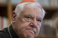 German Cardinal Gerhard Mueller speaks during an interview with The Associated Press in his apartment in Rome, Wednesday, Jan. 4, 2023. Benedict gave his fellow German theologian his old job, as prefect of the Vatican’s doctrine office. He entrusted his life’s theological works to Mueller, who has spent nearly two decades organizing them in a 16-volume, 25,000-page opus along the lines of Thomas Aquinas’ Summa Theologica. He gave him his old flat on the top floor of a Vatican apartment building, where he had lived as Cardinal Joseph Ratzinger. (AP Photo/Domenico Stinellis)