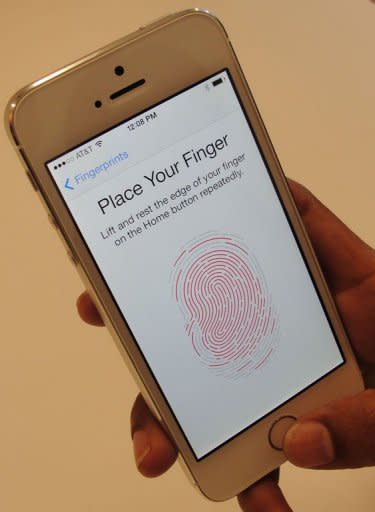 New iPhone 5S handsets let people use their fingerprints to unlock the smartphones at an iPhone event at Apple's headquarters in Silicon Valley on September 10, 2013 in Cupertino, California