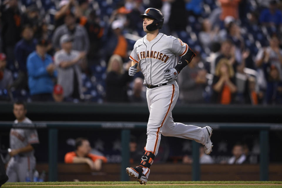 San Francisco Giants' Buster Posey heads home on his home run during the fourth inning of the team's baseball game against the Washington Nationals, Friday, June 11, 2021, in Washington. (AP Photo/Nick Wass)