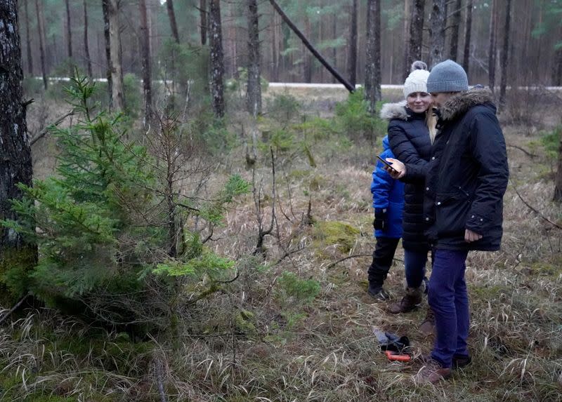 Taavi Sepp and his wife Katrin Sagur use mobile application to find and harvest their Christmas tree near Kuuresaare