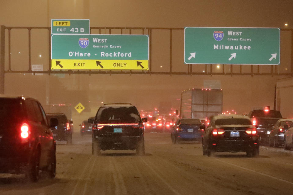 Heavy traffic is seen on Interstate I90/I94 in Chicago, Friday, Jan. 17, 2020. Hundreds of flights canceled as winter storm hits city during evening commute Friday, creating sloppy rush hour. (AP Photo/Nam Y. Huh)