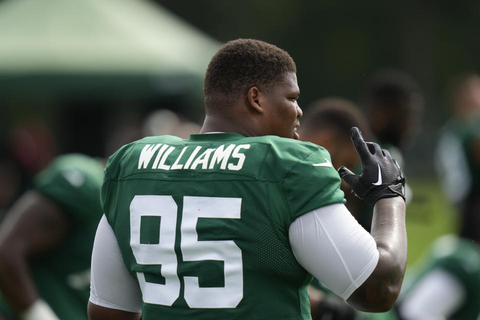 New York Jets' Quinnen Williams warms-up during a joint practice with Tampa Bay Buccaneers in Florham Park, N.J., Wednesday, Aug. 16, 2023. (AP Photo/Seth Wenig)