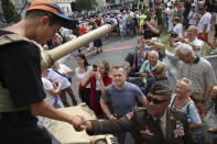 Gen. Darryl Williams, the new commanding general of United States Army Europe and Africa, second right, greets people during a picnic marking the Polish Army Day in Warsaw, Poland, Monday, Aug. 15, 2022. The Polish president and other officials marked their nation's Armed Forces Day holiday Monday alongside the U.S. army commander in Europe and regular American troops, a symbolic underlining of NATO support for members on the eastern front as Russia wages war nearby in Ukraine. (AP Photo/Michal Dyjuk)