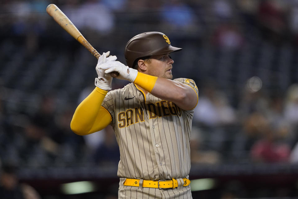 San Diego Padres' Eric Hosmer hits against the Arizona Diamondbacks during the first inning of a baseball game, Wednesday, June 29, 2022, in Phoenix. (AP Photo/Matt York)