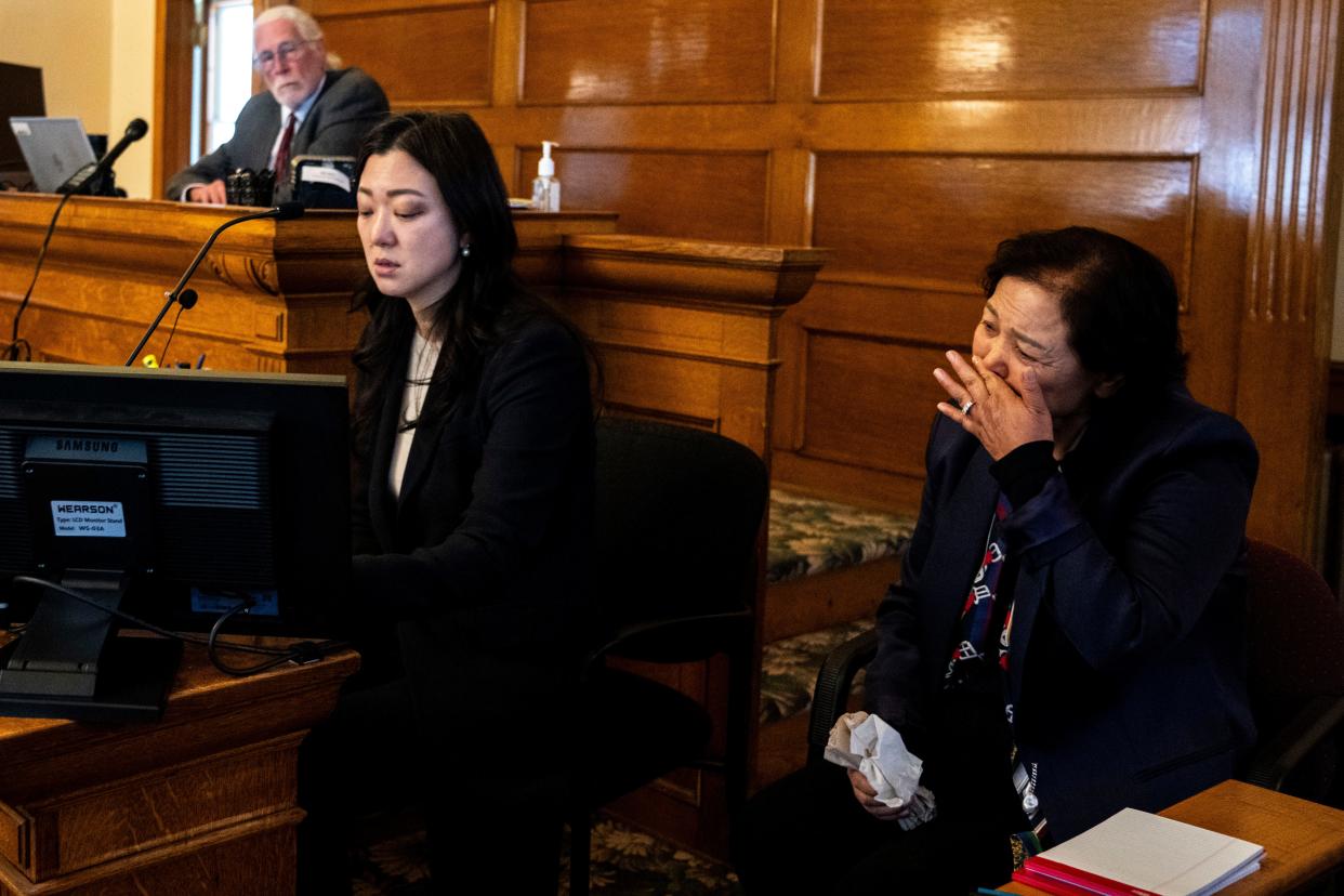 Soojin Nam, Sung Woo Nam's sister, reads a victim impact statement written by her mother, Bong Nam, right, during a sentencing hearing for Gowun Park at the Dallas County Courthouse on Thursday in Adel.