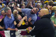 Pennsylvania Lt. Gov. John Fetterman, the Democratic nominee for the state's U.S. Senate seat, right, poses for a photo with a supporter after speaking at a rally in Erie, Pa., on Friday, Aug. 12, 2022. (AP Photo/Gene J. Puskar)