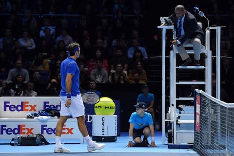 Switzerland's Roger Federer remonstrates with the umpire after being made to replay a point his second set tie-break against Alexander Zverev during their men's singles semi-final match on day seven of the ATP World Tour Finals - Credit: BEN STANSALL/AFP/Getty Images