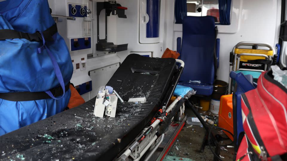 Broken glass is strewn across the back of an ambulance after the strikes on Odesa. - Victor Sajenko/AP