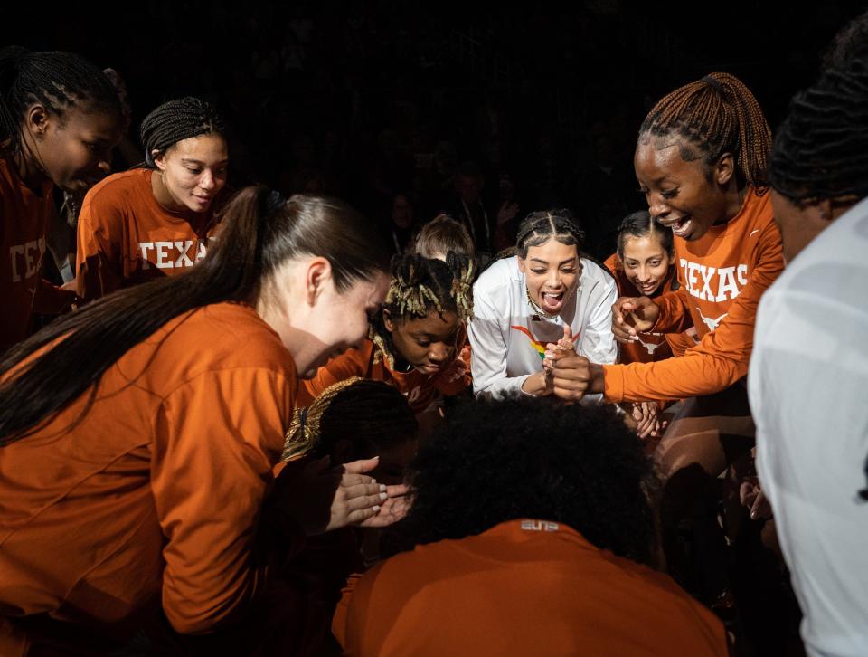 Texas players dance as the starters are announced before Wednesday night's win over No. 14 Oklahoma to force a three-way tie atop the Big 12 standings. "They're an incredible team," OU coach Jennie Baranczyk said. "I don't understand why Texas isn't ranked."