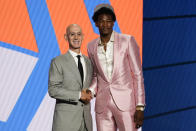 Kai Jones poses for a photo with NBA Commissioner Adam Silver after being selected as the 19th overall pick by the New York Knicks during the NBA basketball draft, Thursday, July 29, 2021, in New York. (AP Photo/Corey Sipkin)