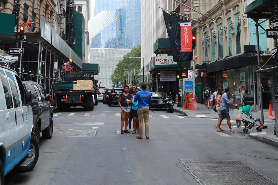 <p>Construction on Fulton Street at Nassau Street continues as people take photos with One World Trade Center in the background, Aug. 12, 2017. (Photo: Gordon Donovan/Yahoo News) </p>