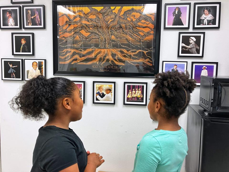 Mila Wilmot, a Waynesboro third-grader; and Samaya Smith, a second-grader from Stuarts Draft, were students in RISE's summer school program. Here they are looking at the wall of fame, finding their own photo there.