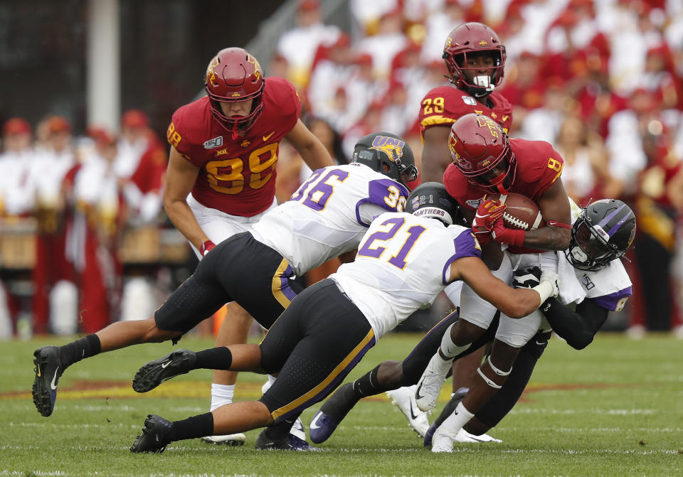 Iowa State wide receiver Deshaunte Jones(8) is brought down by Northern Iowa's Trevon Alexander(36), Christian Jegen(21) and Spencer Perry(8) during the first half of an NCAA college football game, Saturday, Aug. 31, 2019, in Ames. (AP Photo/Matthew Putney)