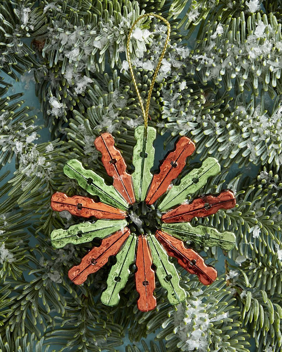 red and green ornament on a tree made out of mini clothespins