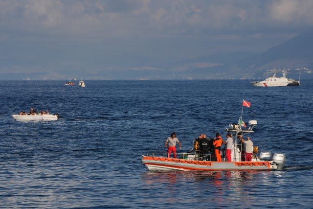 A dive team from the Italian Fire and Rescue Service leaving the site of the Bayesian 