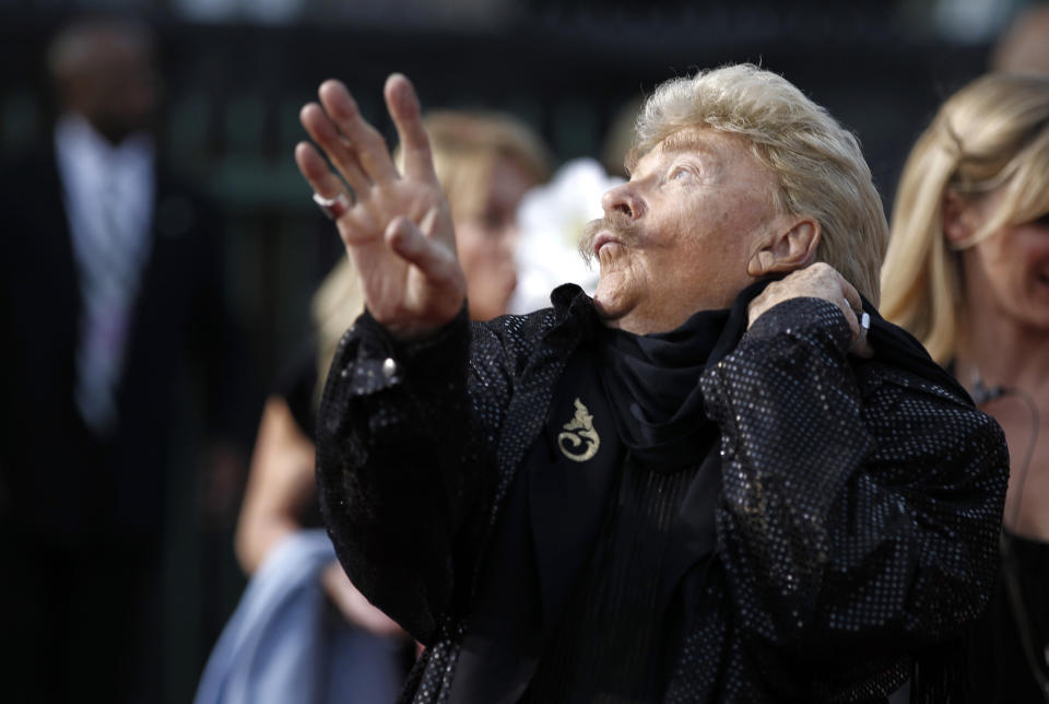 CORRECTS AGE TO 88 - FILE - In this Friday, Jan. 14, 2011, file photo, Rip Taylor arrives at the 16th Annual Critics' Choice Movie Awards in Los Angeles. Taylor, the mustached comedian with a fondness for confetti-throwing who became a television game show mainstay in the 1970s, died Sunday, Oct. 6, 2019. He was 88. (AP Photo/Matt Sayles, File)