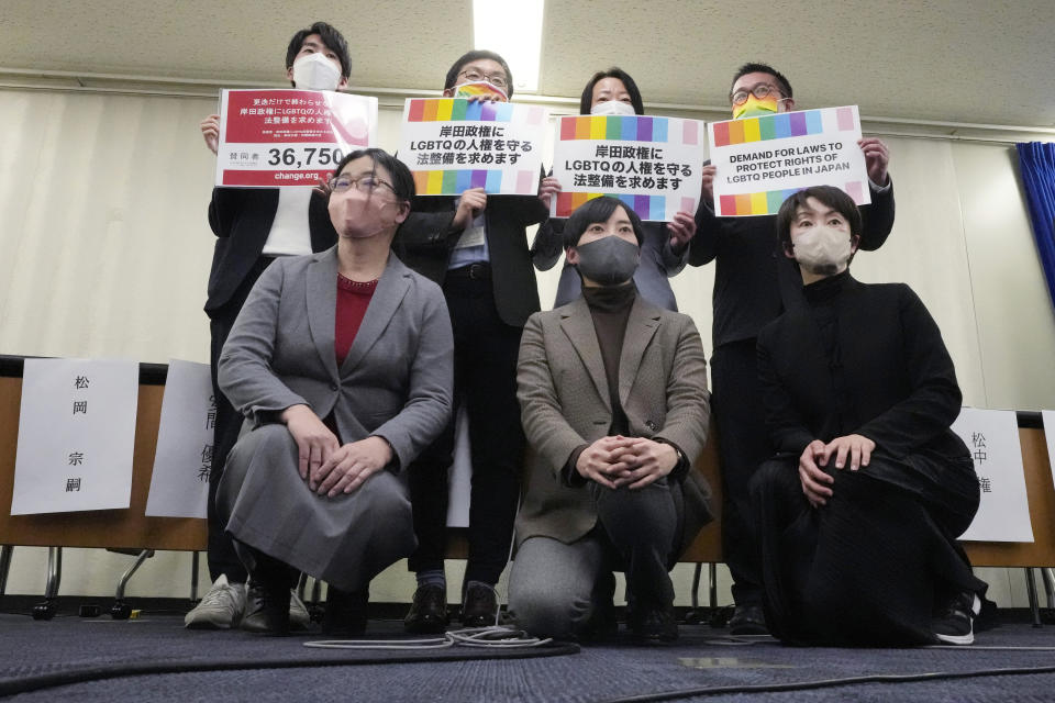 From top left, Soshi Matsuoka, organizer of "Demand for Laws to Protect Rights of LGBTQ People in Japan", Yuichi Kamiya, Executive Director of the Japan Alliance for LGBT Legislation, Takako Uesugi, director for Marriage For All Japan, Gon Matsunaka, director for Marriage For All Japan, Yuki Anma, Director of the Japan Alliance for LGBT Legislation, Akira Nishiyama, Deputy Secretary General of the Japan Alliance for LGBT Legislation,Kanae Doi, Japan Director for Human Rights Watch, pose for photographers during a press conference Tuesday, Feb. 7, 2023, in Tokyo. Japanese LGBTQ people and rights groups held news conference to protest what they say are discriminatory remarks made by top aides of Prime Minister Fumio Kishida. They demand his government enact an equality law before G-7 summit. (AP Photo/Eugene Hoshiko)