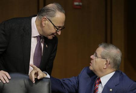 U.S. Senators Charles Schumer (D-NY) (L) and Robert Menendez (D-NJ) (R) talk before U.S. Treasury Secretary Jack Lew (not pictured) testifies before the Senate Finance Committee on the U.S. government debt limit in Washington October 10, 2013. REUTERS/Gary Cameron