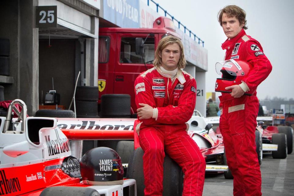 This image released by Universal Pictures shows Chris Hemsworth, left, and Daniel Bruhl in a scene from "Rush." (AP Photo/Universal Pictures, Jaap Buitendijk)