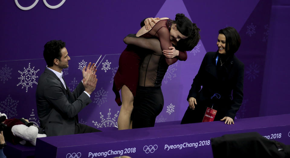 <p>FEBRUARY 20: Tessa Virtue and Scott Moir of Canada celebrate winning the gold medal along their coaches Marie-France Dubreuil and Patrice Lauzon at ‘kiss and cry following the Figure Skating Ice Dance Free Dance program on day eleven of the PyeongChang 2018 Winter Olympic Games at Gangneung Ice Arena on February 20, 2018 in Gangneung, South Korea. (Photo by Jean Catuffe/Getty Images) </p>