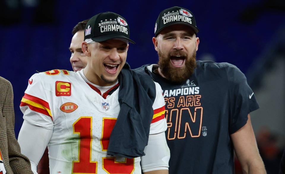 Jan 28, 2024; Baltimore, Maryland, USA; Kansas City Chiefs quarterback Patrick Mahomes (15) and Chiefs tight end Travis Kelce (R) celebrate on the stage prior to the trophy presentation after their' game against the Baltimore Ravens in the AFC Championship football game at M&T Bank Stadium. Mandatory Credit: Geoff Burke-USA TODAY Sports