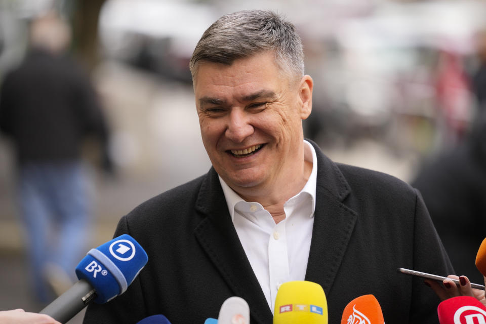 Croatia's President Zoran Milanovic smiles as he addresses the media outside a polling station after casting his vote in Zagreb, Croatia, Wednesday, April 17, 2024. Croatia is voting in a parliamentary election after a campaign that centred on a bitter rivalry between the president and prime minister of the small European Union and NATO member. (AP Photo/Darko Bandic)
