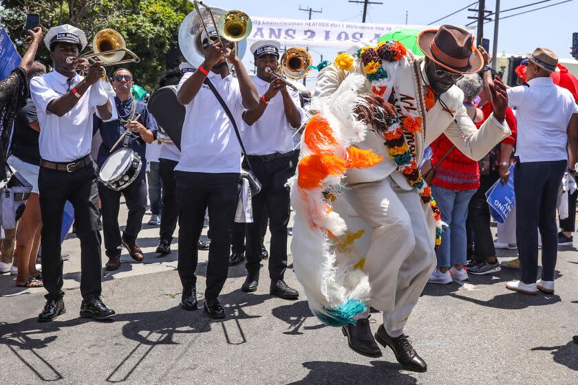 Los Angeles, CA - June 17: A delegation who traveled from New Orleans with Mayor LaToya Cantrell leads community members in a 2nd line down the newly named, "New Orleans Corridor." on Saturday, June 17, 2023 in Los Angeles, CA. (Jason Armond / Los Angeles Times)