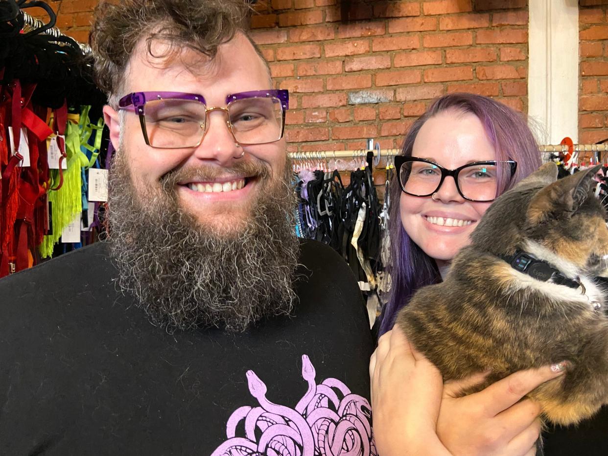 Randy Gill, left, and Kristy Gabel are business partners. With their shop cat, Tiffany, they run Medusas sex shop on Monroe Avenue in Rochester.